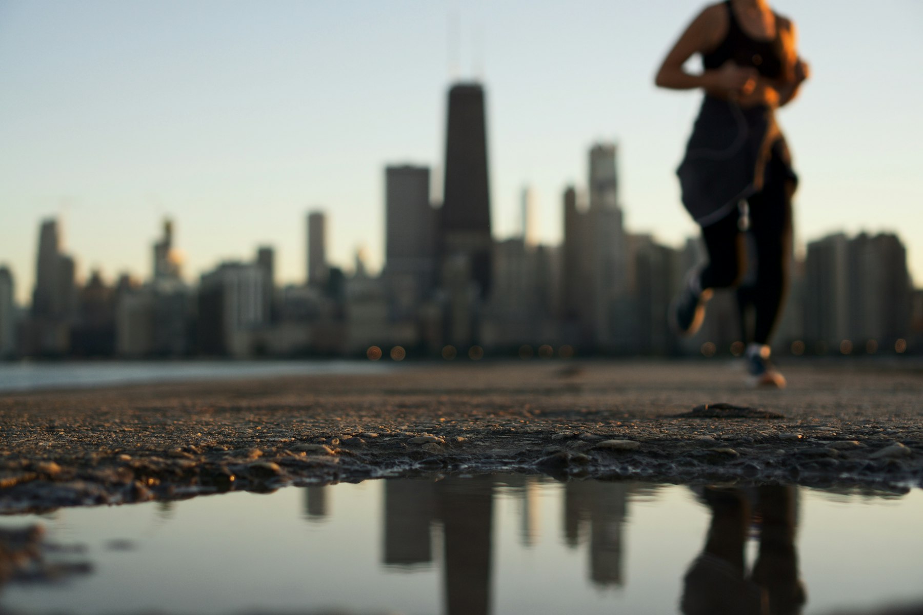 A runner on a city street in the morning