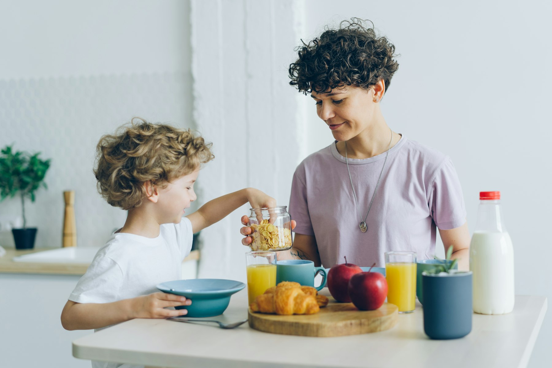 A parent and a child at home in the morning
